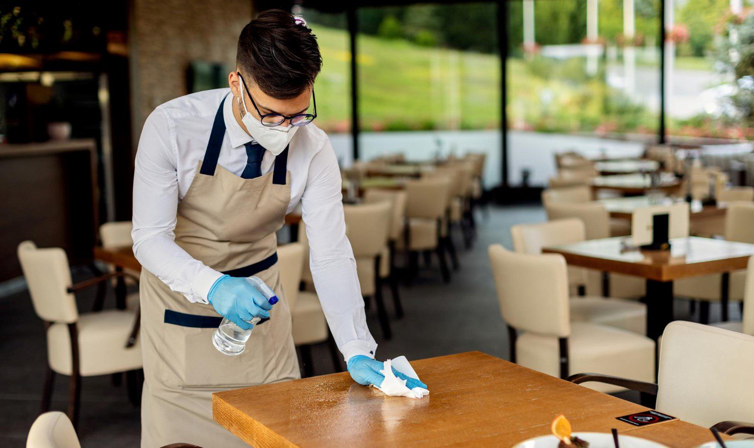 Cleaning of tables and chairs of restaurant in chicago